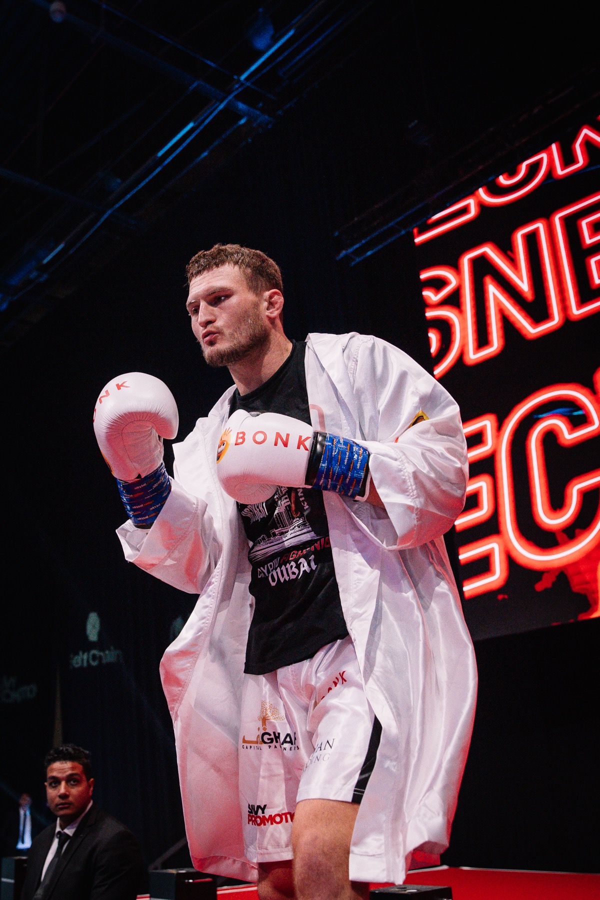 Mike Heckert during a Crypto Fight Night walkout with sponsor branding visible